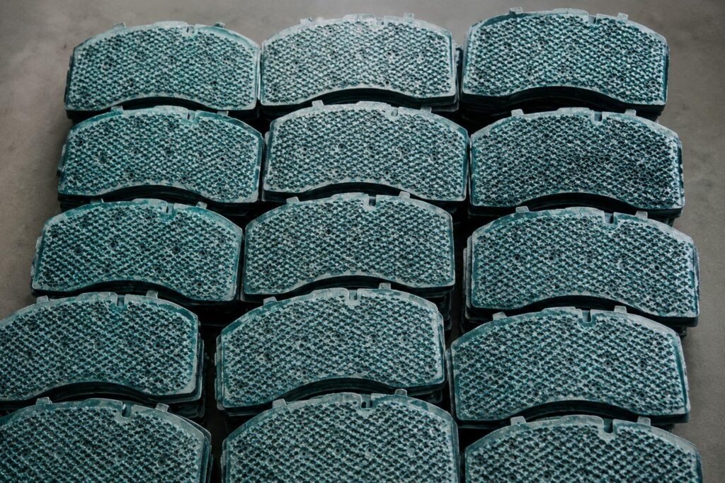 Brake pad bonding process ensuring strong adhesion between friction material and steel backing plate